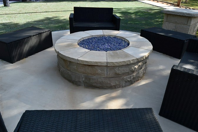 "Close Up Of New Blue Rocks In Gas Fire Pit"