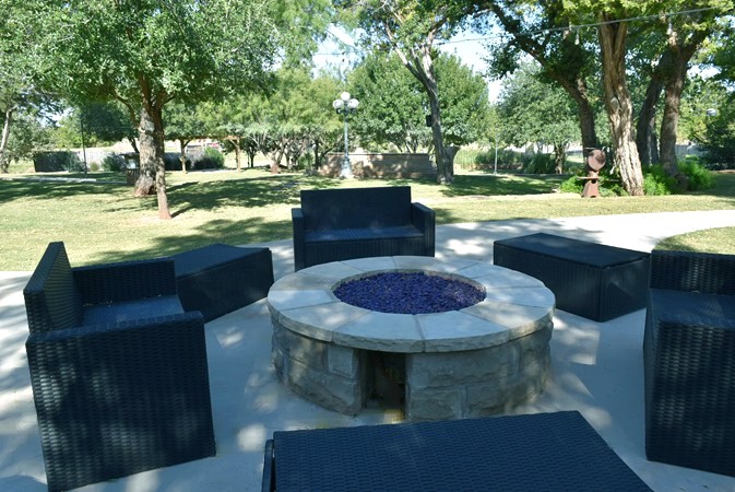 "Gas Fire Pit Overlooking Double Waterfalls"