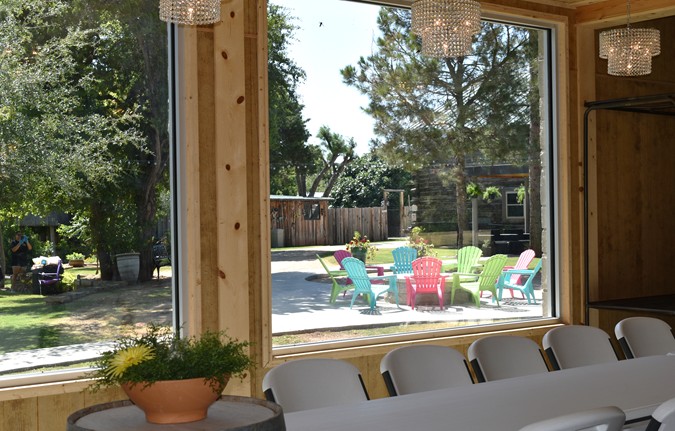 "View Of Gas Fire Pit with Plastic Adirondack Chairs"
