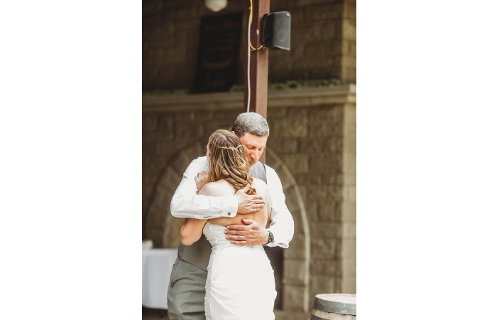 "Hug Before Bride Is Escorted To Pergola"