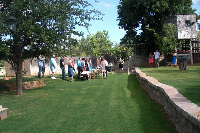 "Wedding Guests Arrive for the Ceremony"