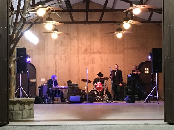 "Jake Hooker & The Outsiders Are Set Up Under The Pavillion"