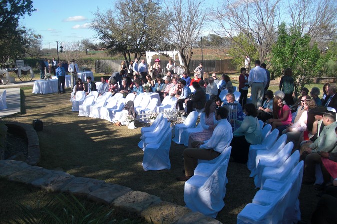 "Guests Gather in Front of Double Waterfall"