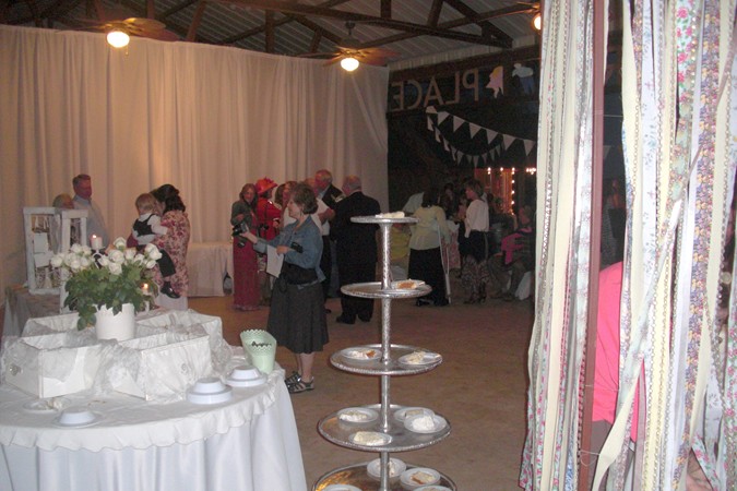 "Guests Enjoy Reception Under Pavilion"