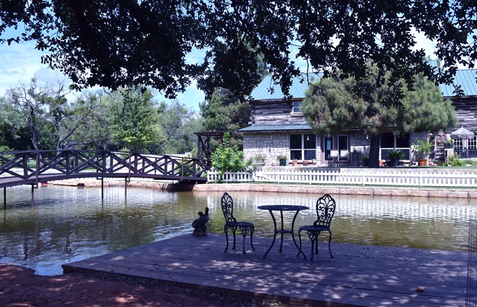 "Shaded Deck Over Water Facing House"