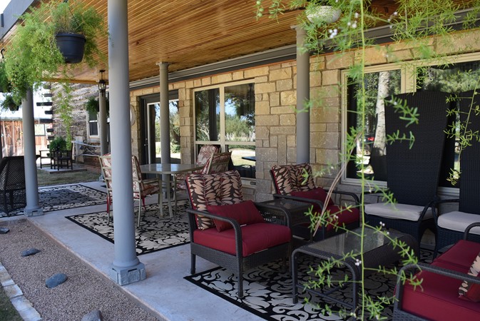 "Hanging Plants Accent Front Edges of Breezeway"