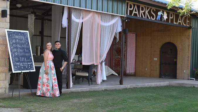 "Snapshot Of Couple With Formal Area In Background"