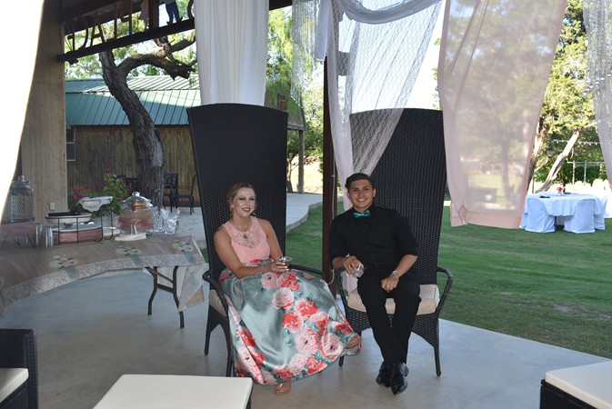 "Snapshot Of Couple In High Back Formal Chairs"